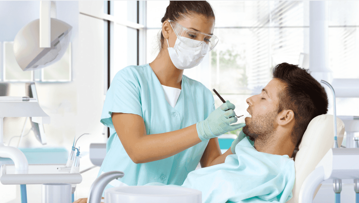 Dental professional working on a patient in a modern dental clinic.